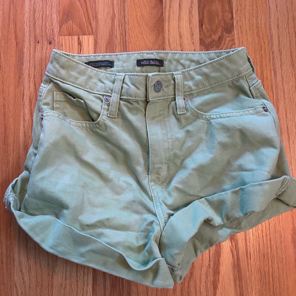 Green roll-cuff jean shorts